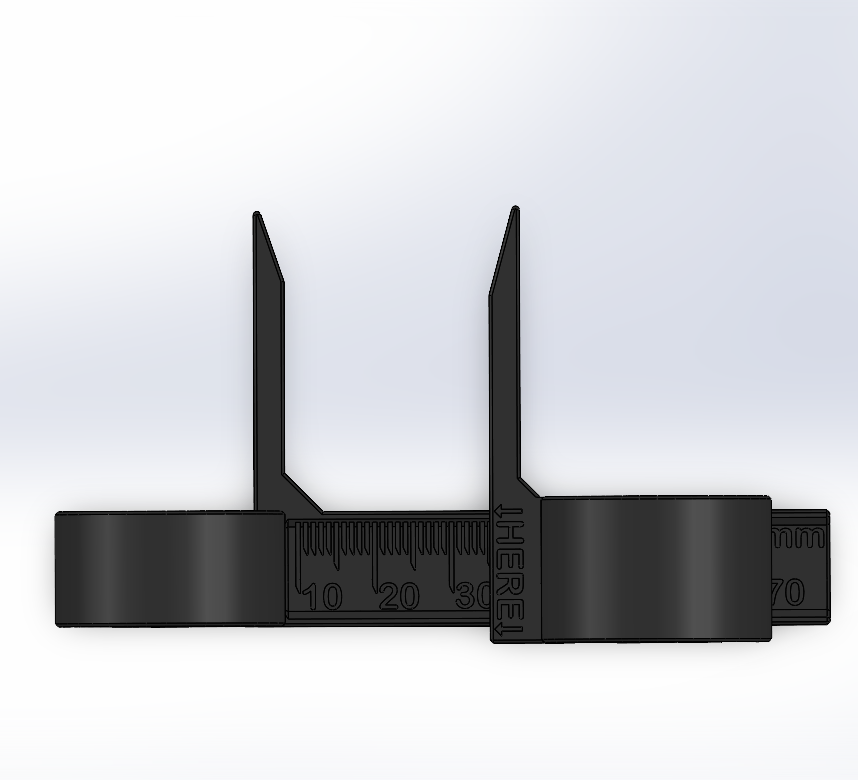 Black measuring device with two antennas on a light gray background
