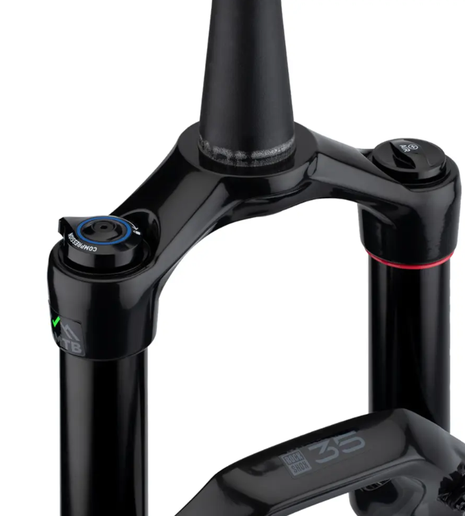 Close-up of a black bicycle fork with branding on a white background