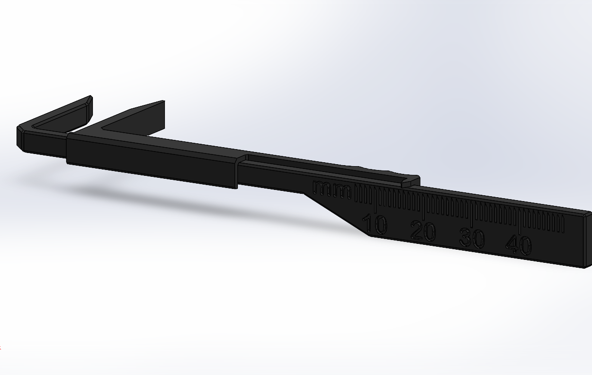 Black metal tool with measurement markings on a white background