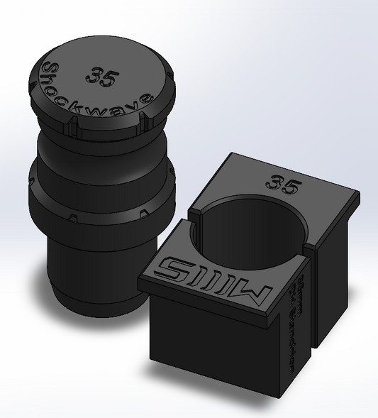 Black shock absorber components with 'Shockwave' branding on a light gray background