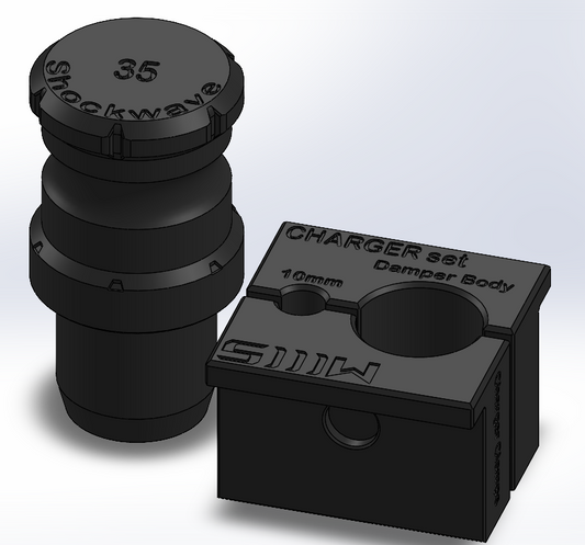 Black shock absorber components with 'Shockwave' branding on a light gray background